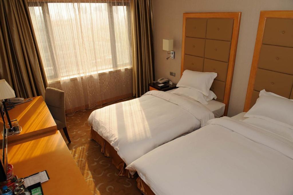Shanghai Sky Rainbow Hotel Quarto foto